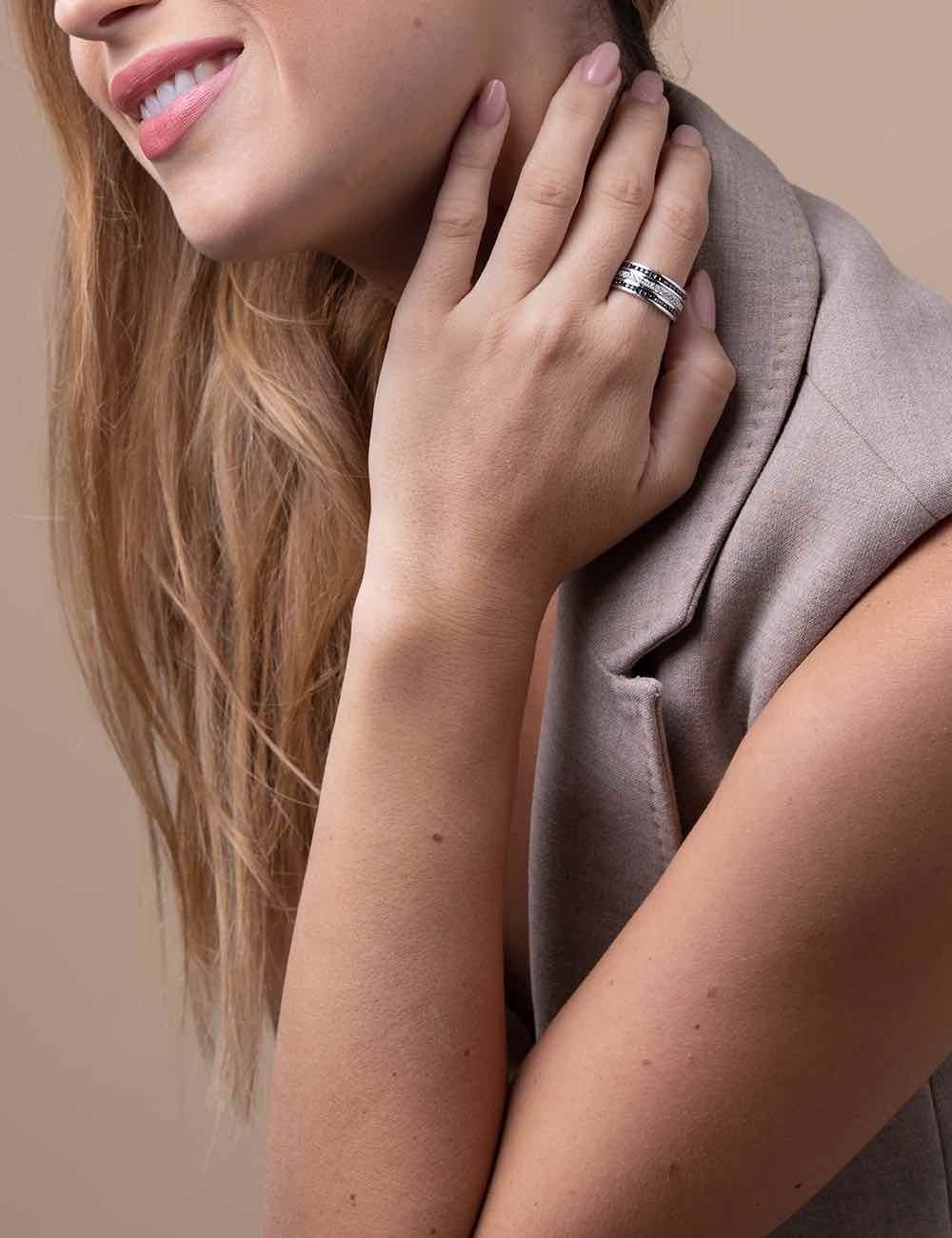 Unisex 'Latitude' ring, innovatively combining black and white diamonds, embodying a distinctly modern style.