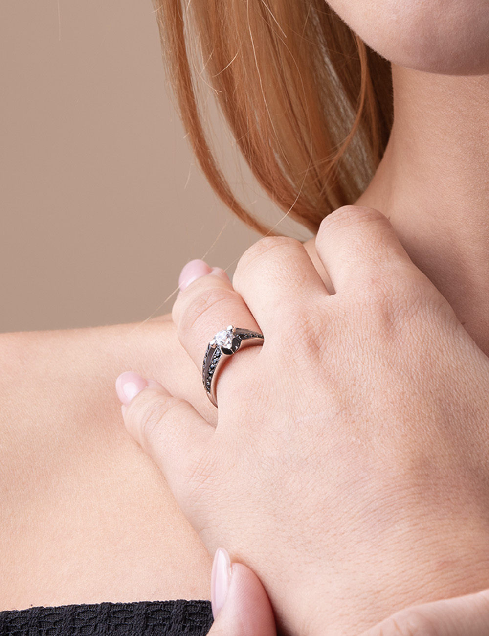 Modern 0.30ct white diamond engagement ring, platinum setting with black diamonds, bold elegance.