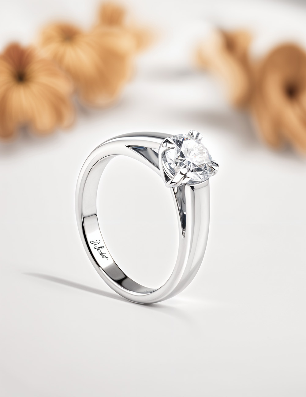 D.Bachet solitaire engagement ring in platinum: 0.50 carat white diamond, sleek contemporary setting, ethically sourced.