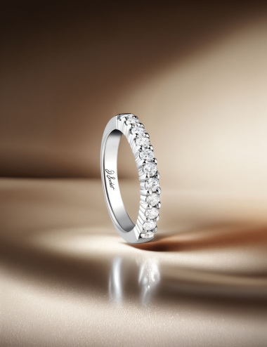 White gold wedding band with natural diamonds in prong setting, custom-made by D.Bachet, modern elegance.