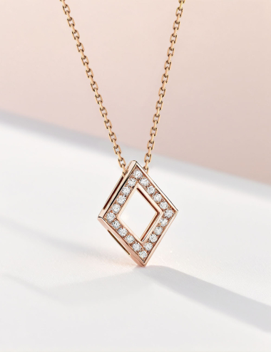 Rose gold pendant with white diamonds, modern diamond shape, combining elegance and artisanal craftsmanship.