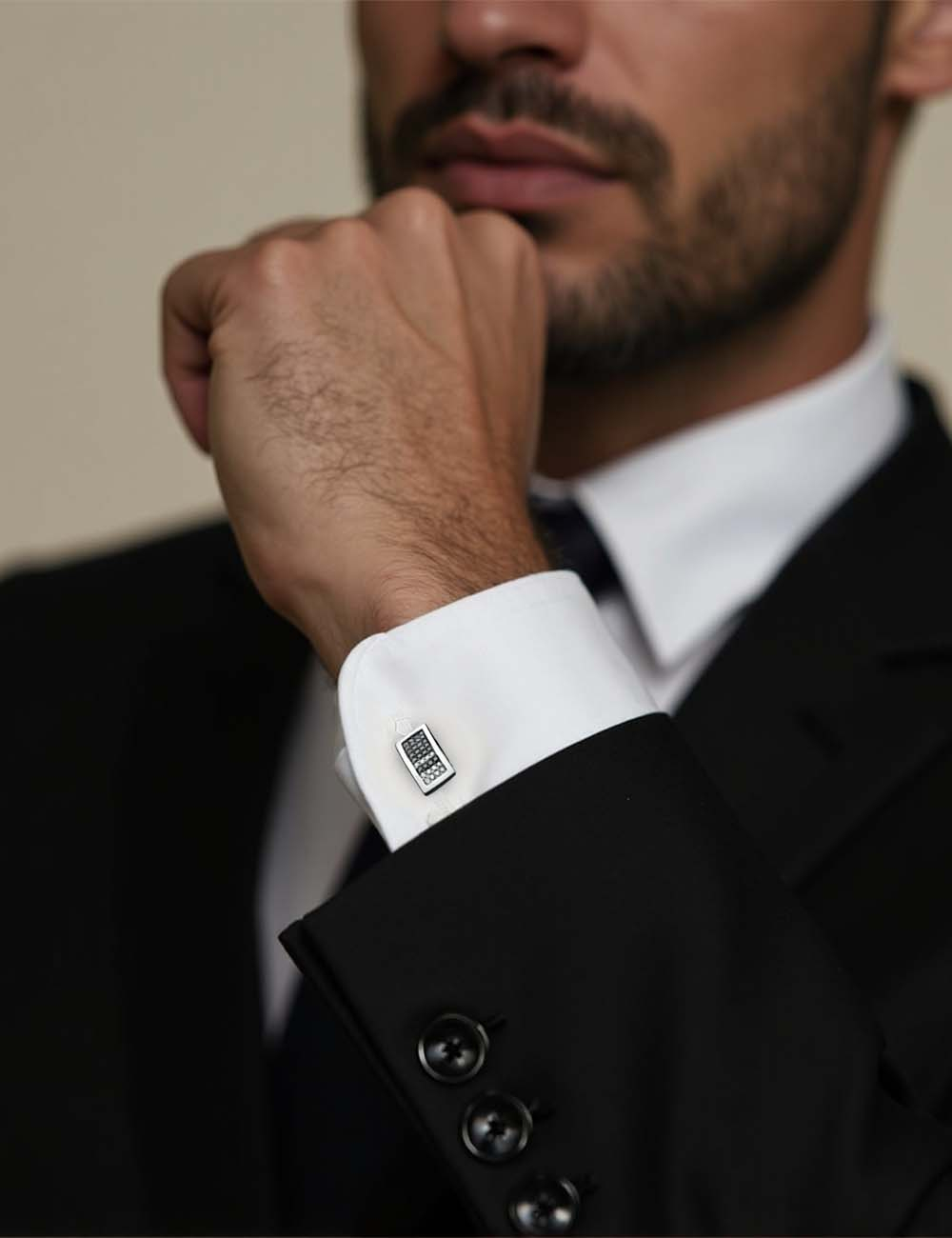 Men's white gold cufflinks with white and black diamond pavé, sophisticated and luxurious design.