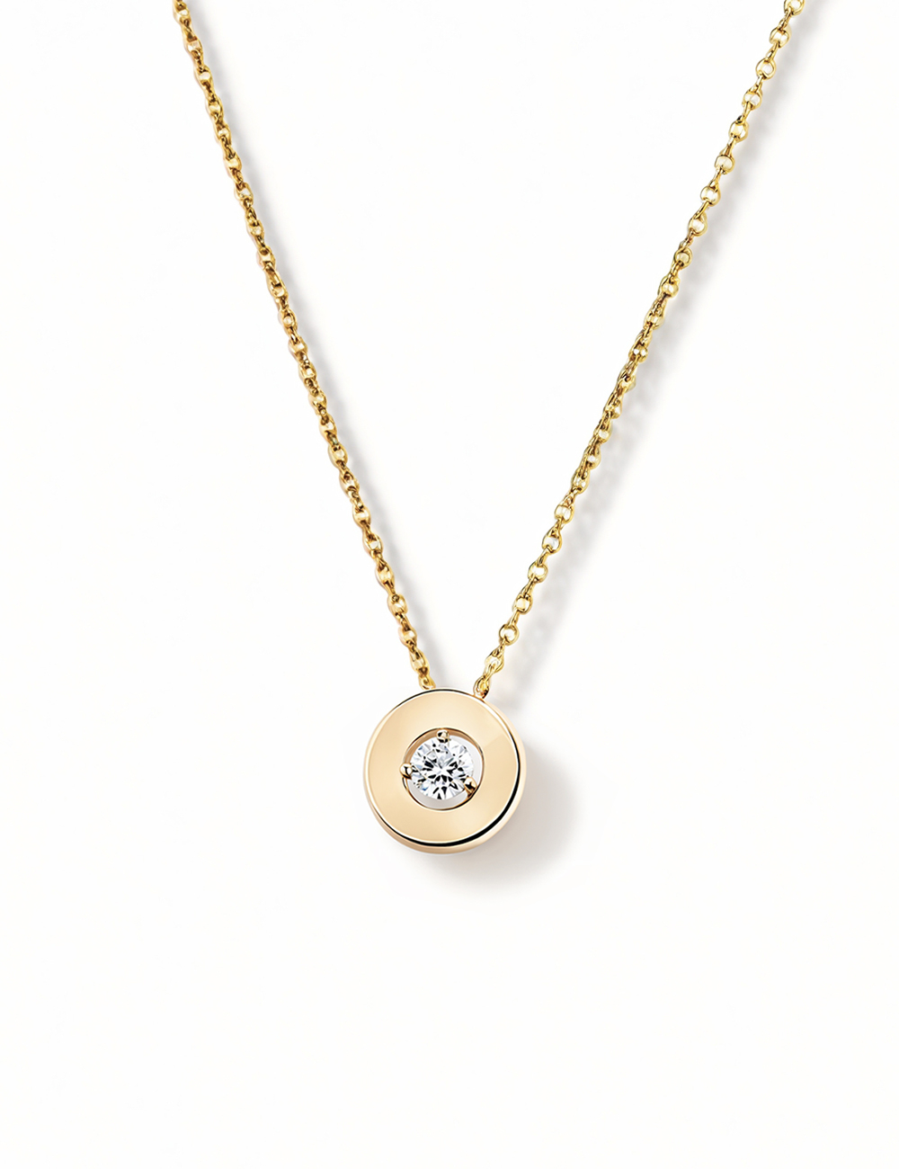 The Aura Pendant by D.Bachet: refined yellow gold and a 0.20-carat diamond, elegantly capturing light and charm.