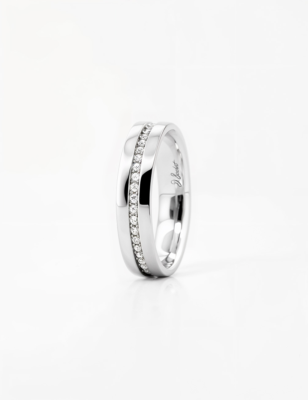 Women's platinum wedding band with grain-set white diamonds, modern and contrasting design, refined jewelry elegance.